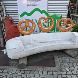A bench in the shape of a Weisswurst