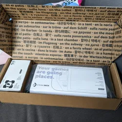 The handheld Steam Deck in its packaging