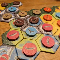 A close up of the board game Cascadia