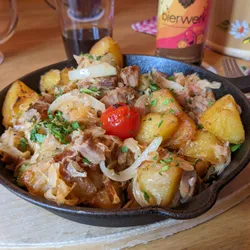 A potato dish in a small pan