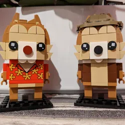 Lego figures of the Disney characters Chip and Dale standing next to each other