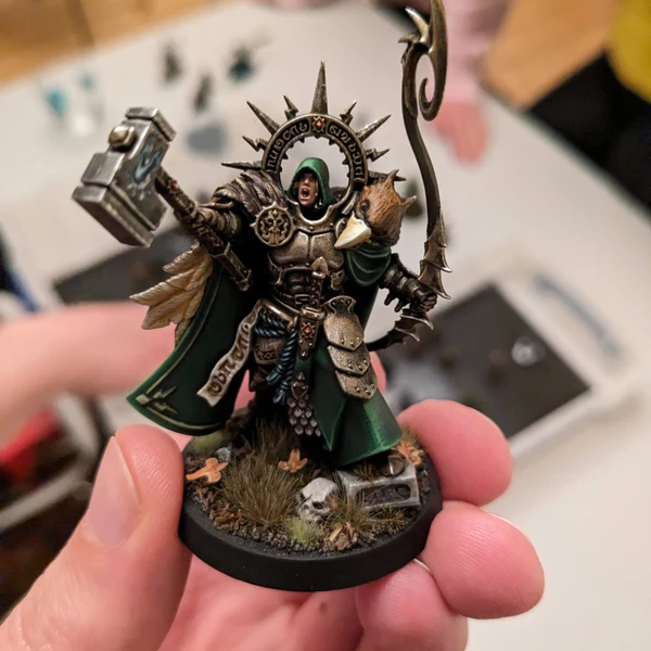 A close-up of a miniature figure from the game Warhammer Age of Sigmar